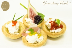 garnishing Pearls with goats cheese